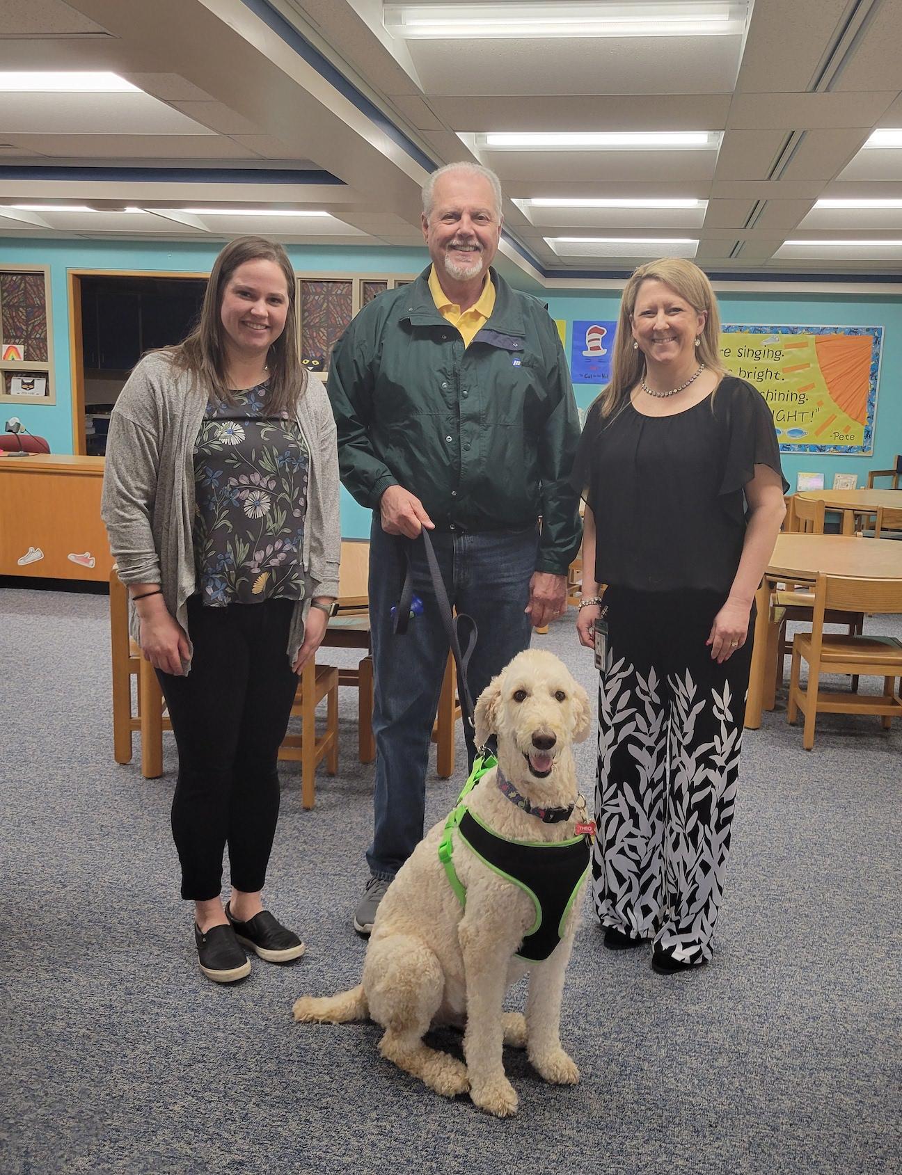 Miss Fiel and Mrs. Colgan with Theo and his owner Larry Kuszaj
