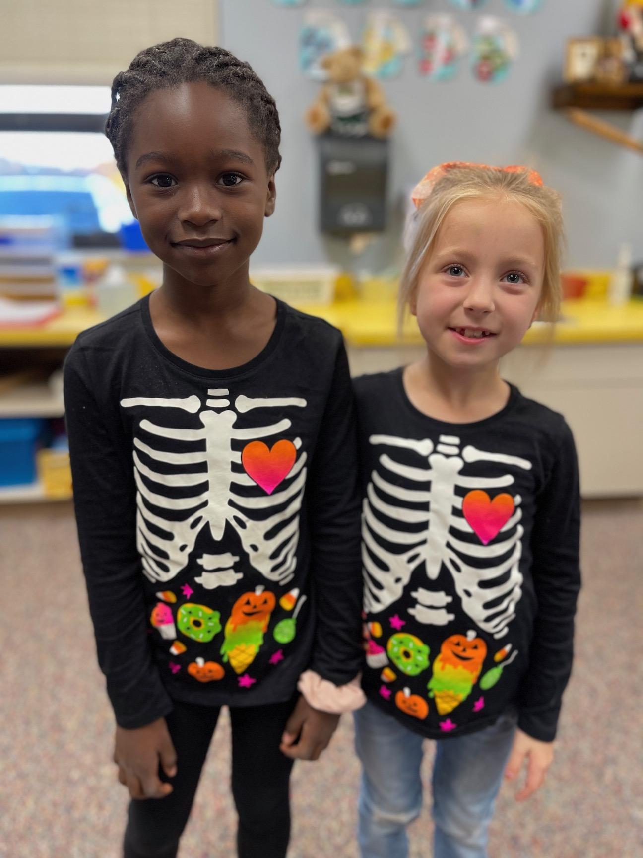 First-graders Michelle Eguaoje and Brynn Goydich “support each other to stay drug free” on Twin Day at Level Green Elementary