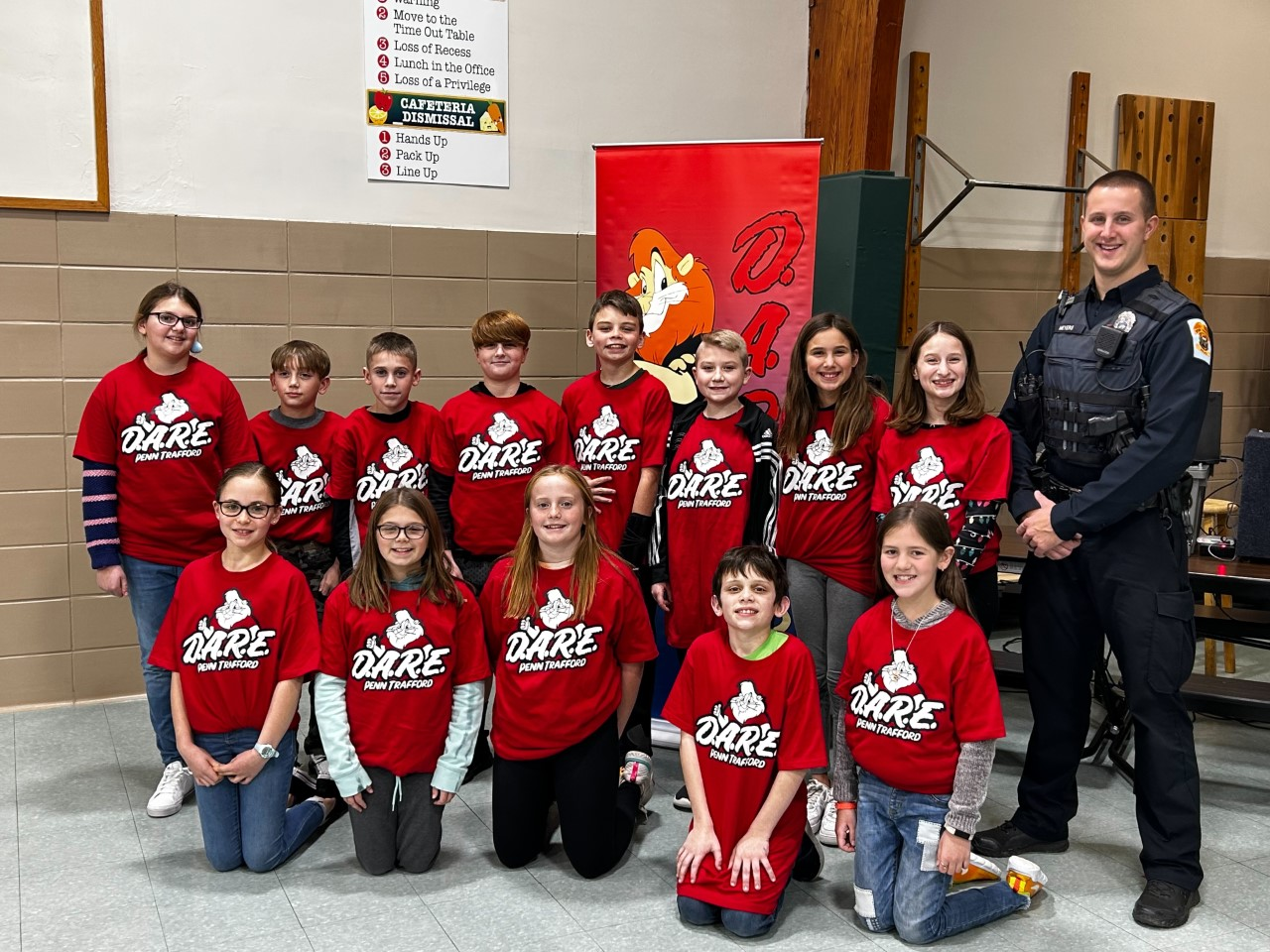 Officer Meyers with the Sunrise Elementary D.A.R.E. project winners