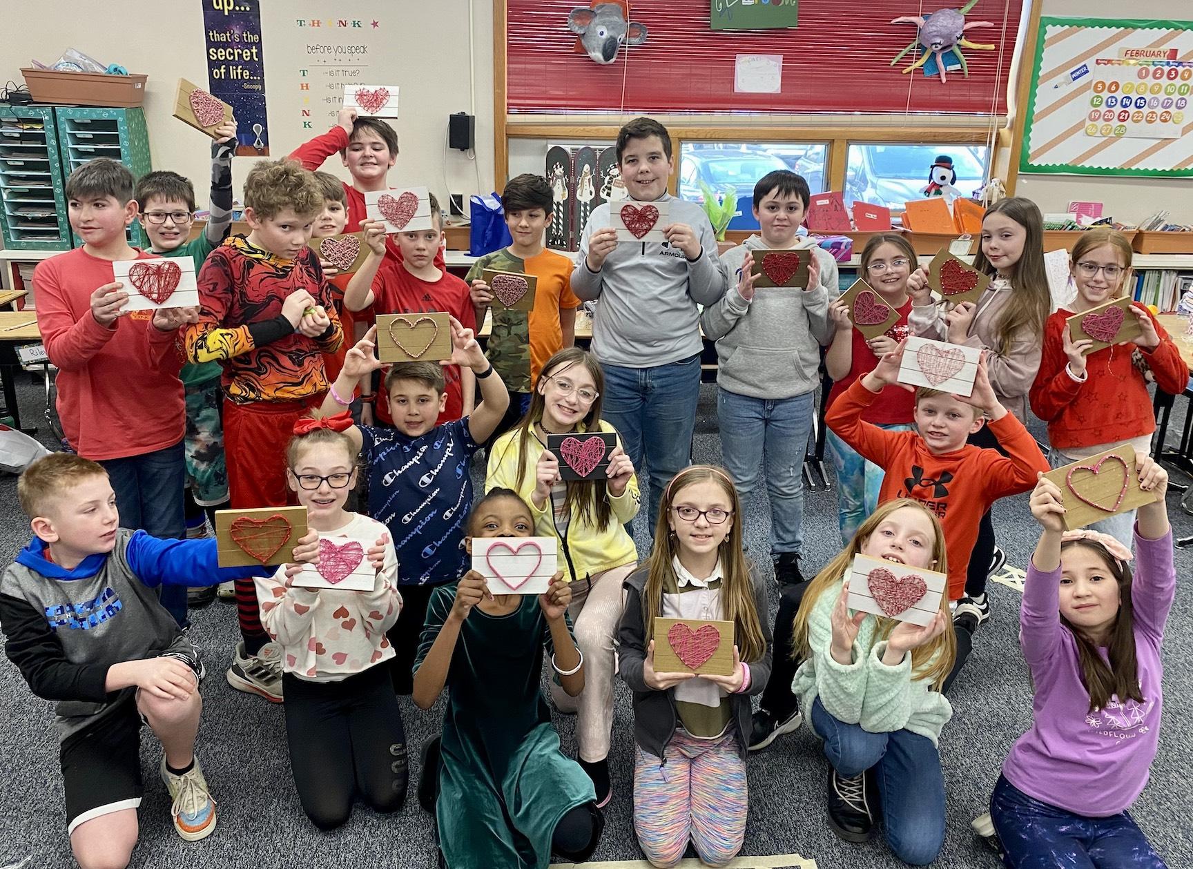 Mrs. Stagno’s 4th-graders at McCullough show off their string-art projects