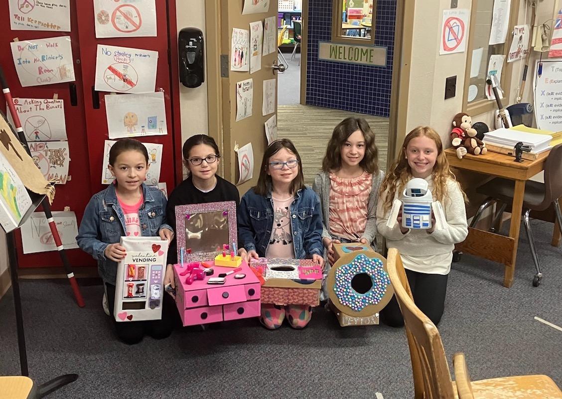 Level Green 4th-graders Sophia Braun, Giano Delio, Hanna Kelleher, Peyton Dobo, and Maiya Pieper show their valentine mailboxes