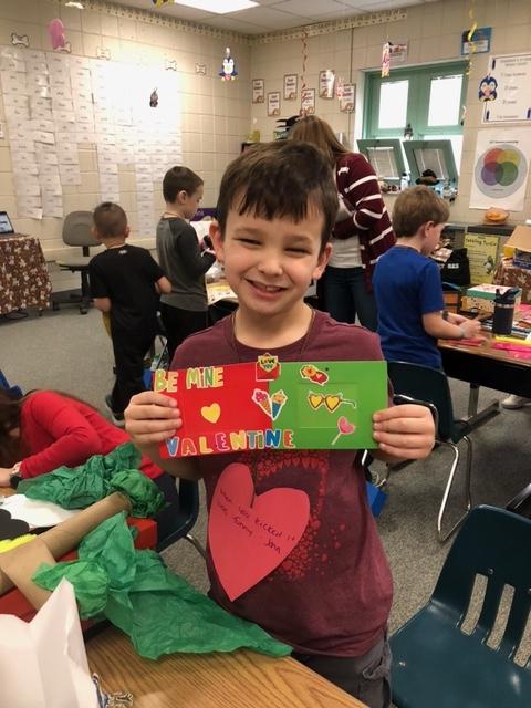 Trafford 1st-grader, Lucas Ross, shows off the valentine he made