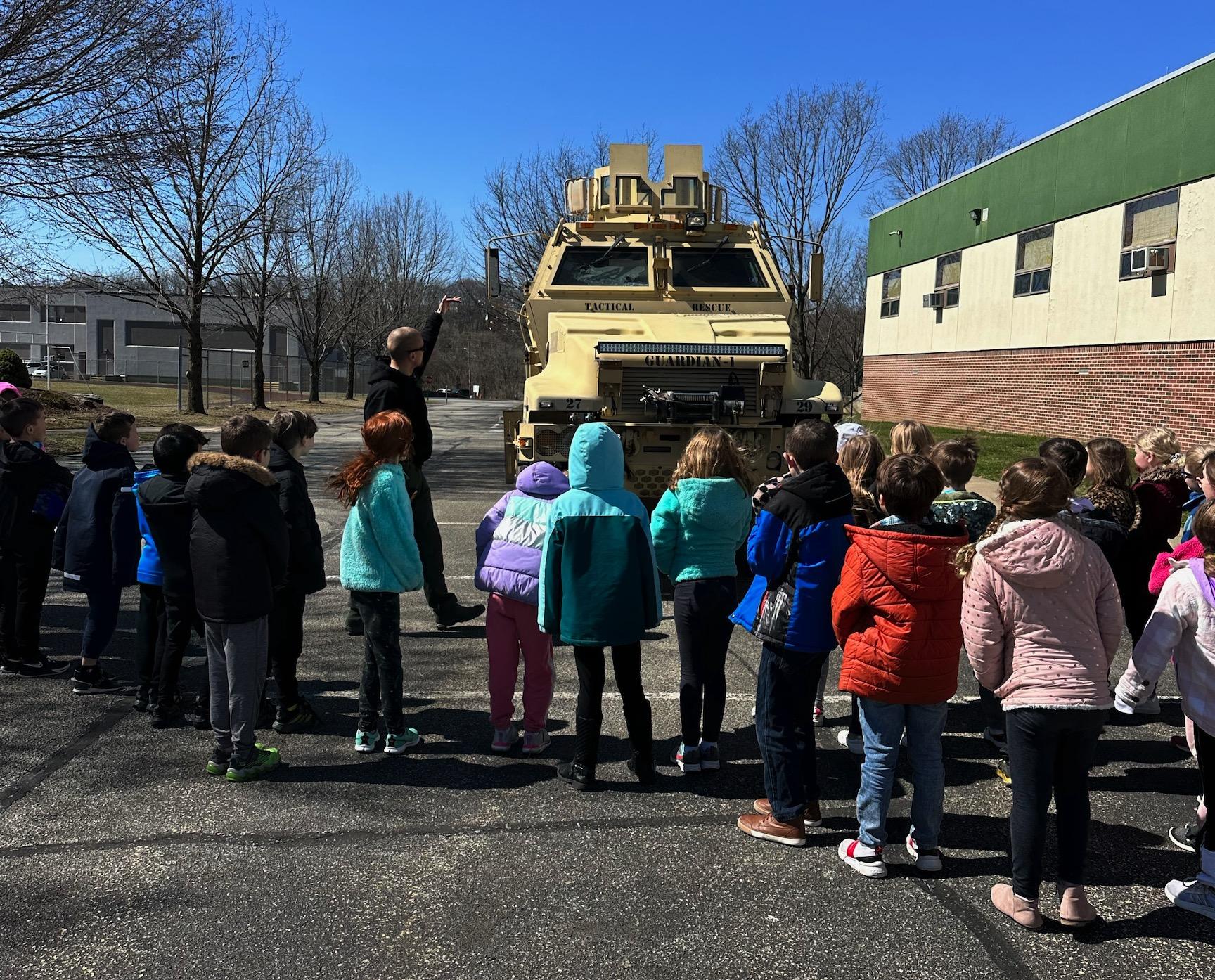 Sgt. Coleman explained the features of the SWAT vehicle to the students