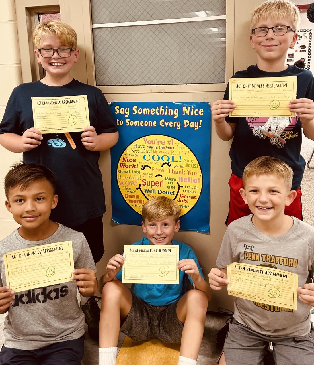 Memphis Bozich, Jude Atchison, Joey Westerlund, Cole Telenko, and Liam McCaw display their kindness task